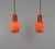 Pair of hand-blown glass orange pendants designed by Massimo Vignelli at the start of his impressive career in design and...