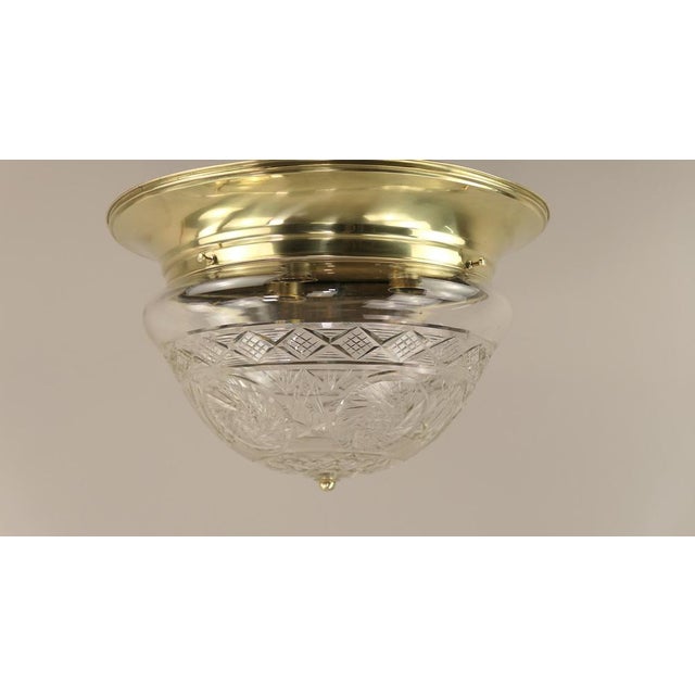 Massive brass holder with hand-cut lead crystal shade. The brass surface is polished. Diameter: 42 cm, height: 26 cm 3xE27...