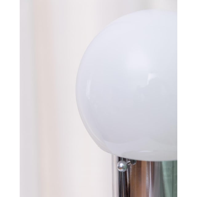 Exceptionally minimalist, space age lamp from Italy around 1980s. The lamp with opal glass shade throws absolutely soft...