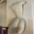 This captivating early 21st century fiberglass half-shell sculpture features a beautifully contoured, classical...