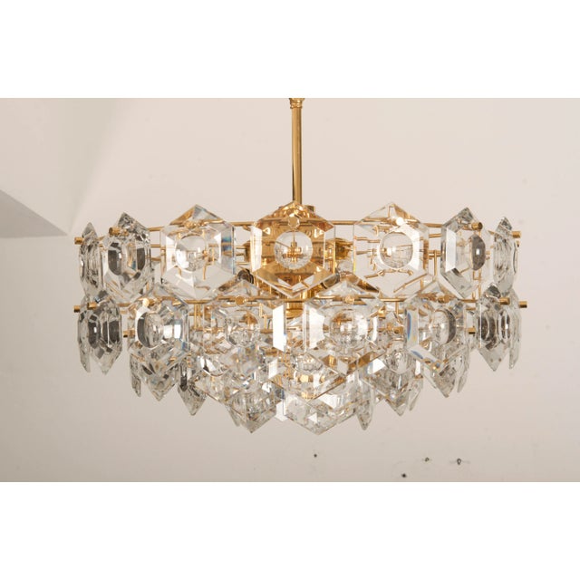 Brass construction gold-plated with crystal elements fitted with six e14 and one e27 sockets up to 60 watts each. made in...