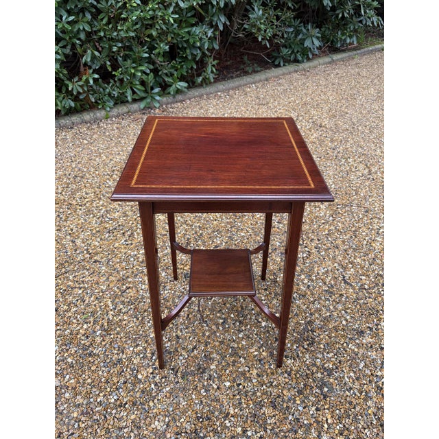 19th Century Mahogany Square Occasional Table with inlaid decoration and lower shelf on square tapering legs Circa: 1880...