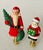 Vintage pair of Santa Claus and Mrs.Claus, 3” mounted on brass bases finials.