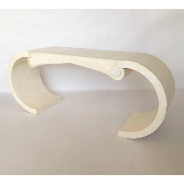 A rare piece. An elegant shaped tessellated marble console and mirror set of the finest craftsmanship by Maitland-Smith....