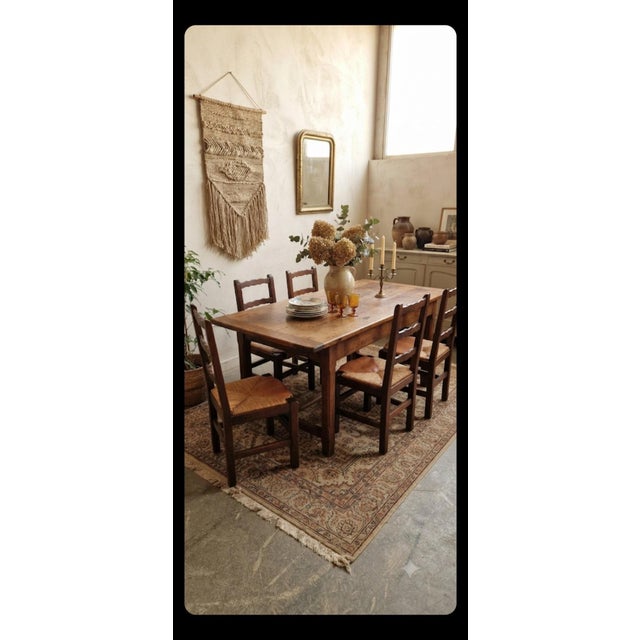 A superb set of six rustic French provincial-style chairs, authentic examples of early 20th-century regional...