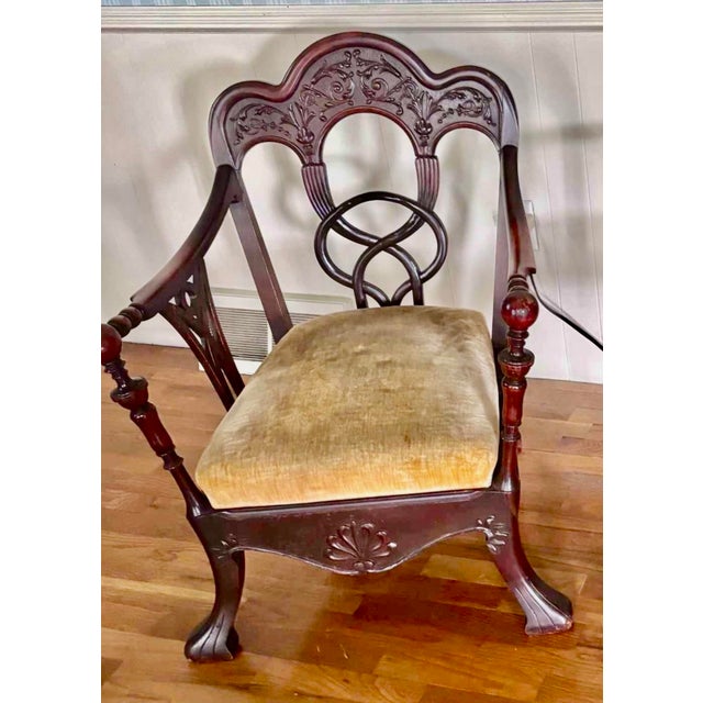 A genuinely rare antique Victorian Chippendale parlor chair with a bold, sculptural infinity-loop back. The sweeping hand-...