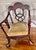 A genuinely rare antique Victorian Chippendale parlor chair with a bold, sculptural infinity-loop back. The sweeping hand-...
