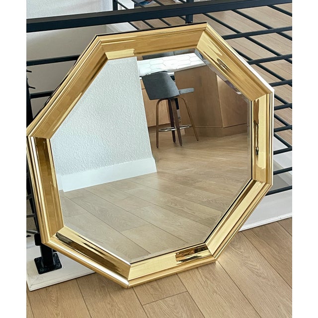 From the fabulous '80's with an Art Deco vibe, this octagonal mirror makes a grand statement at 36" x 36". The faux brass...