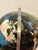 Semi-precious stones featuring black onyx as the ocean, and over 25-30 other gemstones and shells to create this globe...
