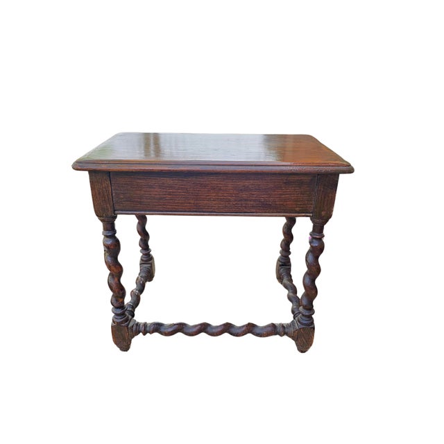 Pair of Antique Oak Barley Twist Nesting Tables A charming pair of antique nesting tables, crafted from richly grained...