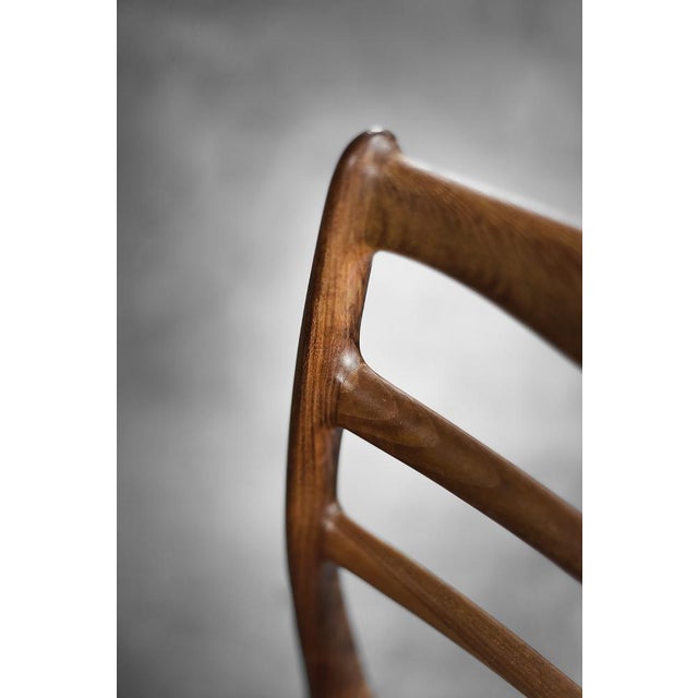 This modernist set of four elegant chairs was manufactured in Denmark during the 1960s. The chair frames are crafted from...