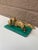A beautiful antique gilt bronze sculpture of a hunting fox with a duck in its mouth, mounted on a polished malachite slab...