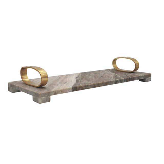 New special order item. Not vintage. The Tadeo Marble Tray features is made of beige marble and features brass oval shaped...