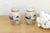 The petite scale of these jars makes them an ideal choice for a mantle or bookshelf, where their intricate narrative...