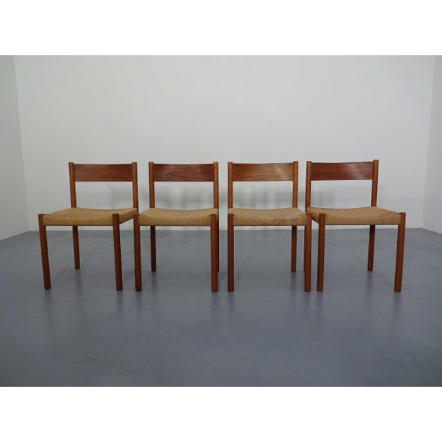 Set of four Danish chairs in teak and paper cord weave. Designed by Poul M. Volther for Frem Røjle in the 1960s. I have...
