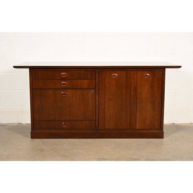 An exceptional Mid-Century Modern executive sideboard, credenza, or bar cabinet By Edward Wormley for Dunbar Furniture...