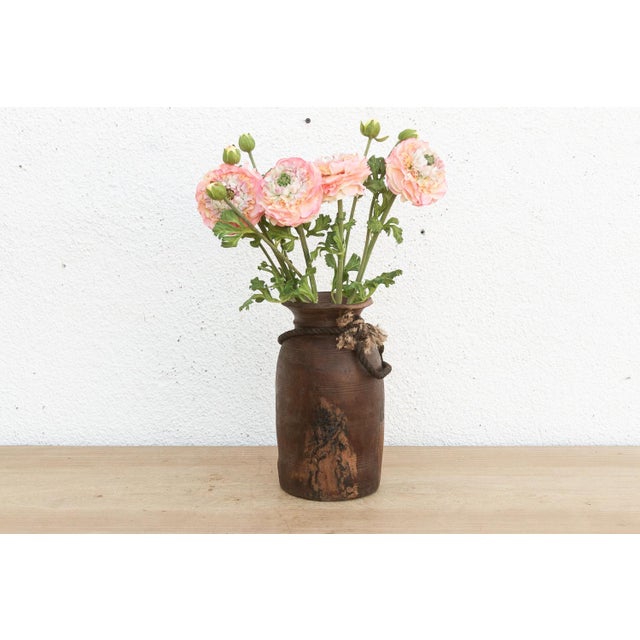 Originally used in village homes for storing milk, ghee, or grains, this antique wooden pot has survived generations of...