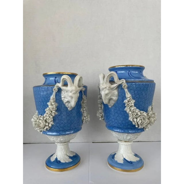 This stylish set of two French porcelain vases are in the Louis XVI style of the late 18th century, and are very much in...