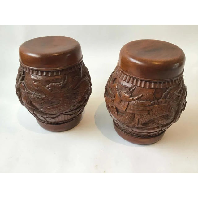 Pair of carved wood Asian dragon covered jars. From a Southampton, NY estate.