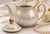 A charming vintage Wade England porcelain teapot finished in a luminous mother-of-pearl lustre glaze with delicate crackle...