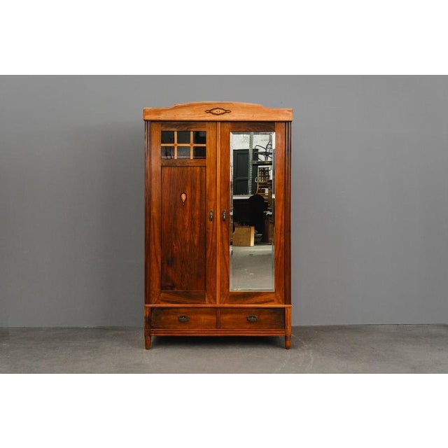 Item: 2-door wardrobe Period & Style: Art Nouveau - Early 20th century Features: - Stylish and practical piece of...