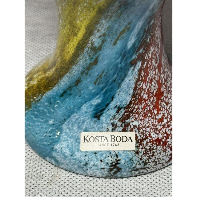 Art glass vase from the “Can Can” series designed by Kjell Engman for Kosta Boda. Hand-formed glass with a characteristic...