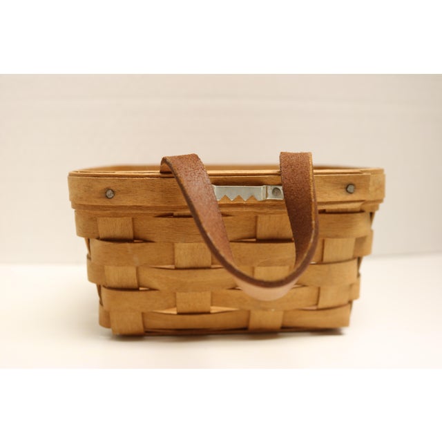 Adorable vintage little handmade Longaberger basket. Perfect key catcher with leather strap and hanger. Signed by the...