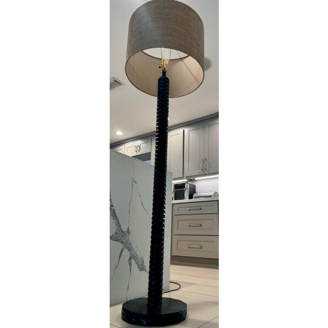 is a handcrafted transitional piece, featuring a rich dark finish on plantation-grown hardwood with detailed hand-carving,...