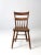 An antique farmhouse chair with understated primitive character and beautifully aged wood. The dining or side chair...