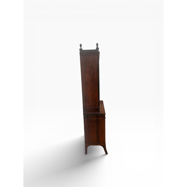 A refined and classically proportioned secretary bookcase by Kittinger, one of America’s most esteemed furniture makers,...