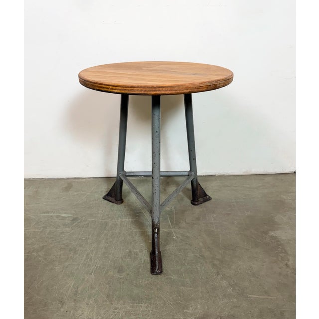 Vintage Industrial factory stool made in former Czechoslovakia during the 1960s It features a plywood seat and a grey iron...