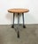 Vintage Industrial factory stool made in former Czechoslovakia during the 1960s It features a plywood seat and a grey iron...