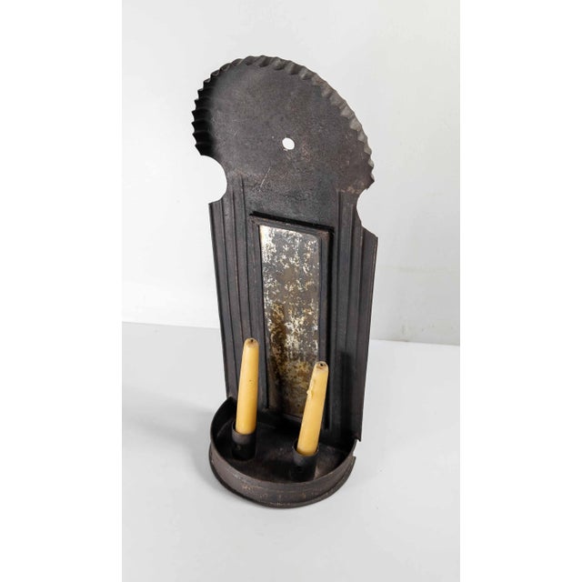 We are selling this nice decorative 19th or 20th century mirror back wall sconce. This colonial revival tin metal sconce...