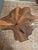 Handcrafted of natural teak wood root and covered in gold and silver leafing, this mixed metallic beauty adds an...