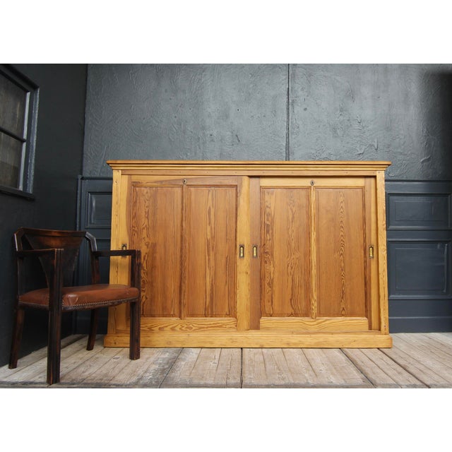 Vintage filing cabinet or office cabinet from the early 20th century. Solidly made of softwood. Restored ready for living....