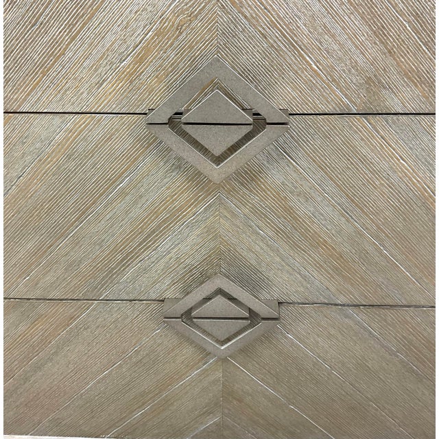 Original retail $2295, stylish Caracole Modern Criss Crossed Nightstand, finished in ash driftwood, three drawers with...