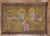 A late 20th century Turkish rug depicting 2 lions outlined in yellow and a pink sheep outlined in light blue on a brown...