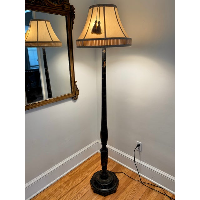 Antique Chinese wood-turned black floor lamp with shade, hand-painted in gold and red with birds and butterflies. Please...