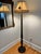 Antique Chinese wood-turned black floor lamp with shade, hand-painted in gold and red with birds and butterflies. Please...