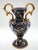 Elegant italian decorative vase in dark blue glossy glaze with rich hand-painted gold detailing and a classic white cameo...