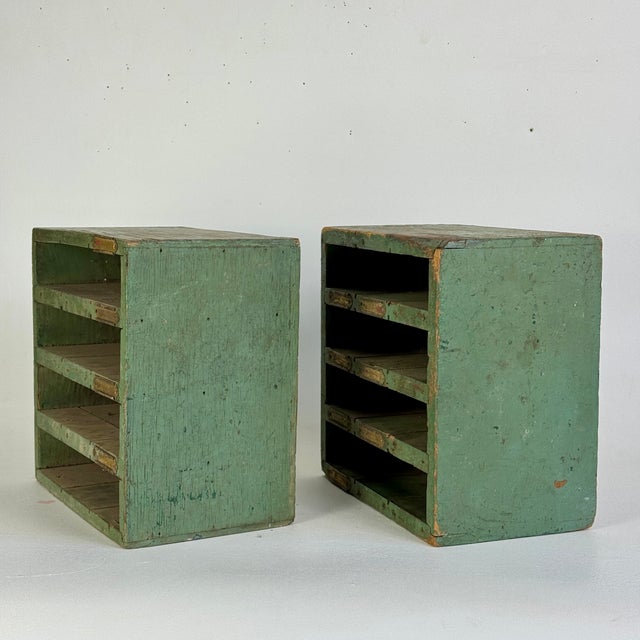 A lovely pair of salvaged wood cabinets in avocado green and brass labels—what's left of them. We believe these came out...