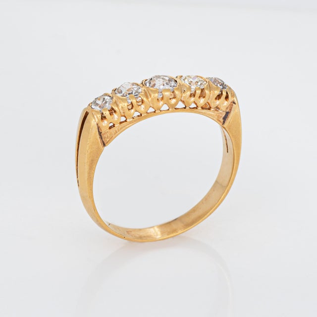 Stylish vintage diamond half hoop ring crafted in 14 karat yellow gold. 5 graduated old mine cut diamonds total an...