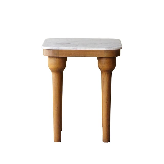 The square wood and marble side table is a timeless piece that elegantly combines wood and marble. The tapered glaze-...