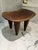 A beautifully hand‑carved wooden stool sourced from Material Possessions in Chicagoland, known for their curated mix of...