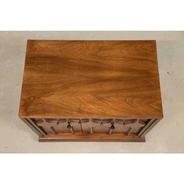 A mid century modern walnut nightstand with a single door. Excellent condition. Circa 1960’s. Made in USA. Unmarked....