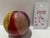 Raku pottery vase identified by the owner as Peter Aslan. Rounded orb form with a narrow opening and bold yellow, red,...