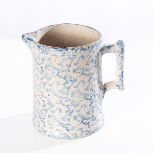 Spongeware pitcher with soft colors. Great decorative piece for the kitchen or for use with a good cleaning.