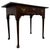 A handsome 18th-century English side table, finely crafted from solid oak and distinguished by its elegant turned legs,...