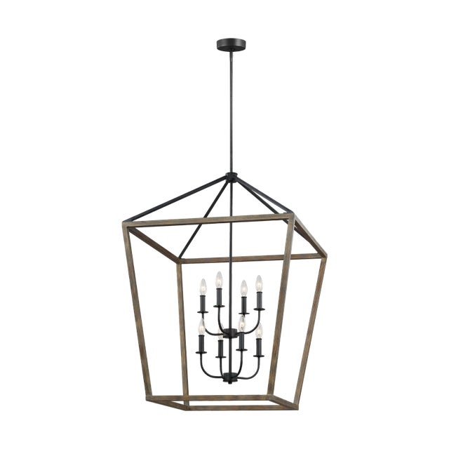 The Sean Lavin Gannet eight light multi-tier chandelier in weathered oak wood / antique forged iron provides abundant...