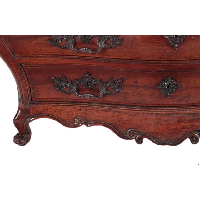 18th Century, French provincial walnut 3-drawer bombay commode with cabriole legs and escargot feet, intricately hand...